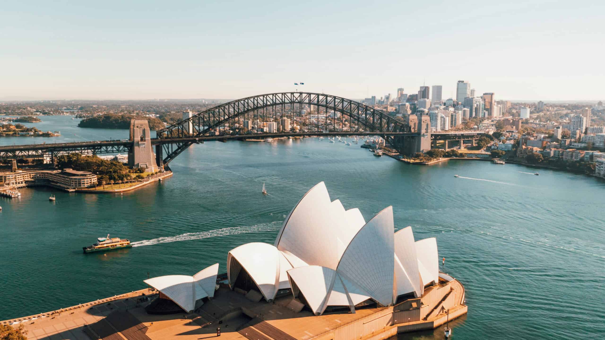 Sydney Opera House and Harbour Bridge skyline in Australia.